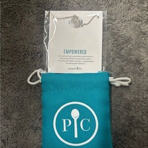 Pampered Chef Silver 'Empowered' Pendant Necklace with Teal Pouch